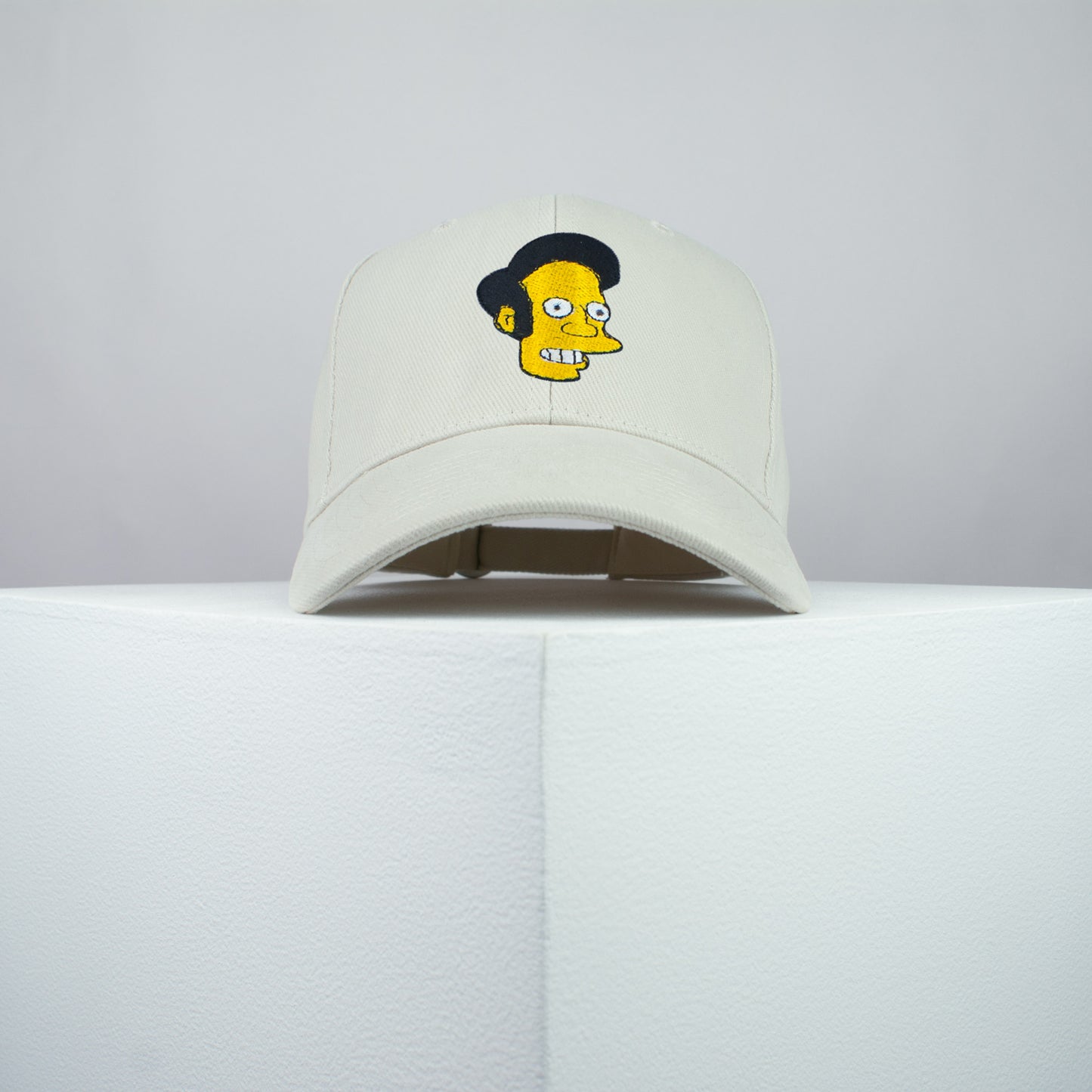 Apu Nahasapeemapetilon embroidered baseball cap beige / the simpsons / bart / marge / homer / embroidery / patch / hat / dad hat / cap / iron on patch / embroidered patch / badge / applique / embroidered / punk patches / trucker hat / snapback / caps / dad hats / baseball hat / mens hat / womens hat / embroidered hat / dad cap / embroidered cap