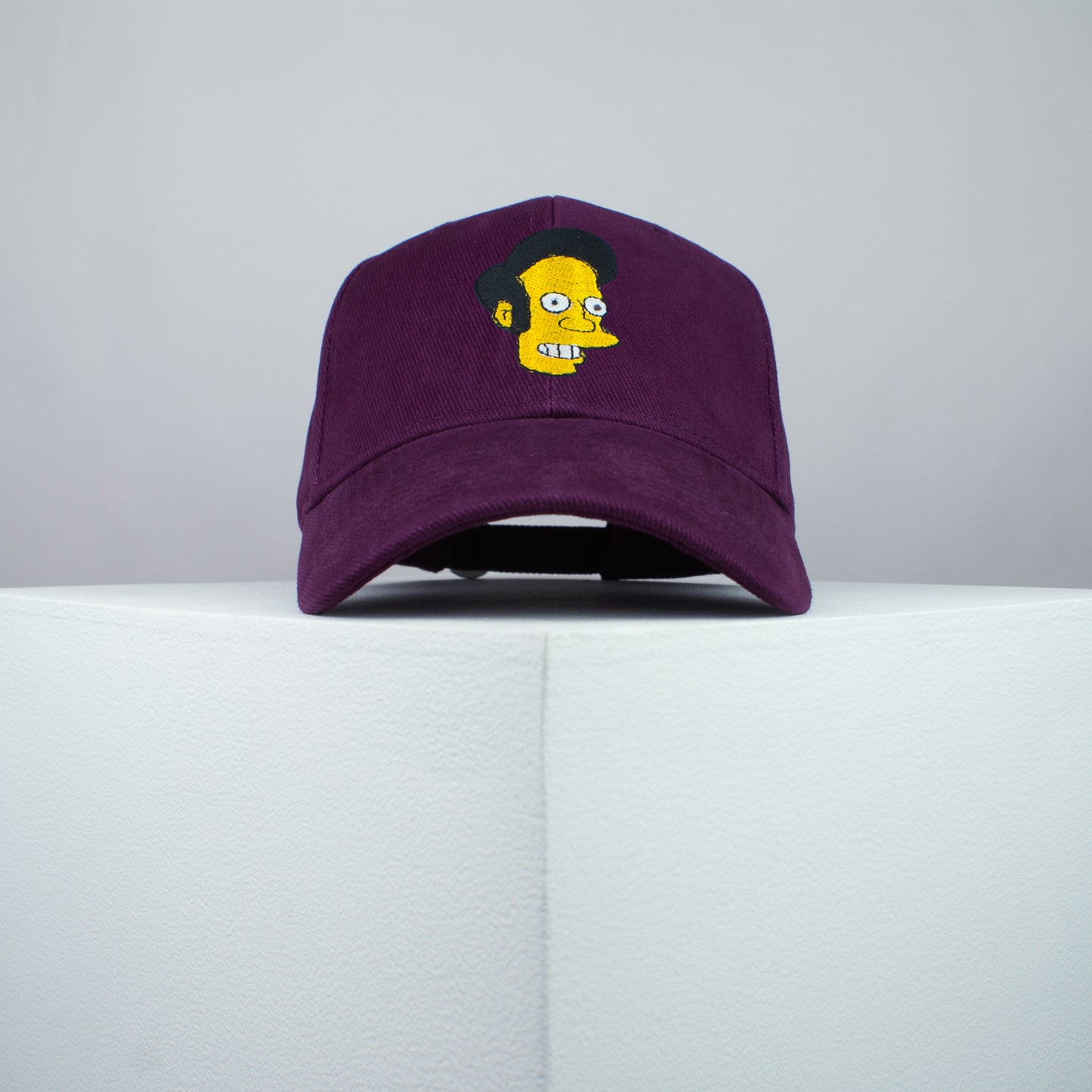 Apu Nahasapeemapetilon embroidered baseball cap burgundy / the simpsons / bart / marge / homer / embroidery / patch / hat / dad hat / cap / iron on patch / embroidered patch / badge / applique / embroidered / punk patches / trucker hat / snapback / caps / dad hats / baseball hat / mens hat / womens hat / embroidered hat / dad cap / embroidered cap
