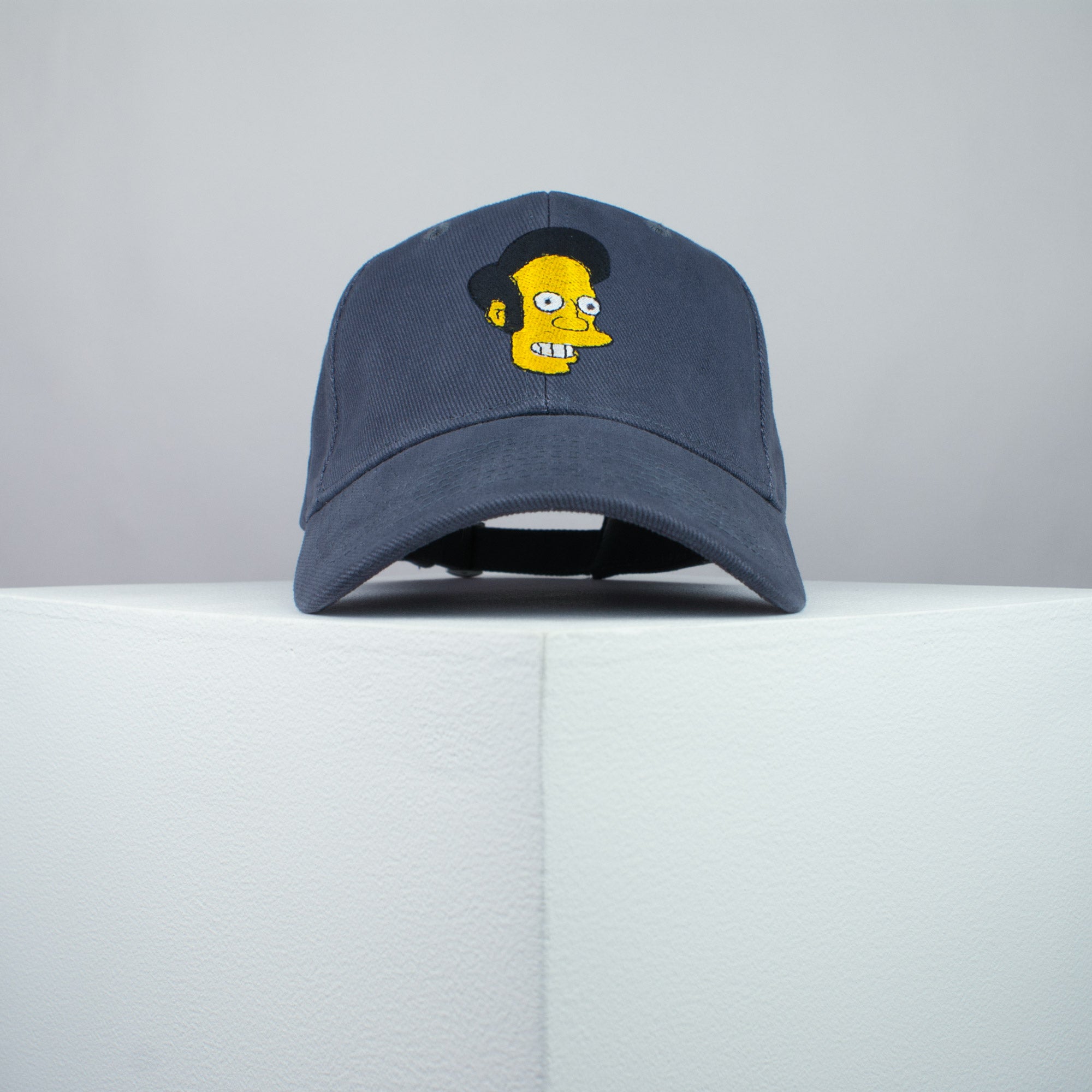 Apu Nahasapeemapetilon embroidered baseball cap grey / the simpsons / bart / marge / homer / embroidery / patch / hat / dad hat / cap / iron on patch / embroidered patch / badge / applique / embroidered / punk patches / trucker hat / snapback / caps / dad hats / baseball hat / mens hat / womens hat / embroidered hat / dad cap / embroidered cap