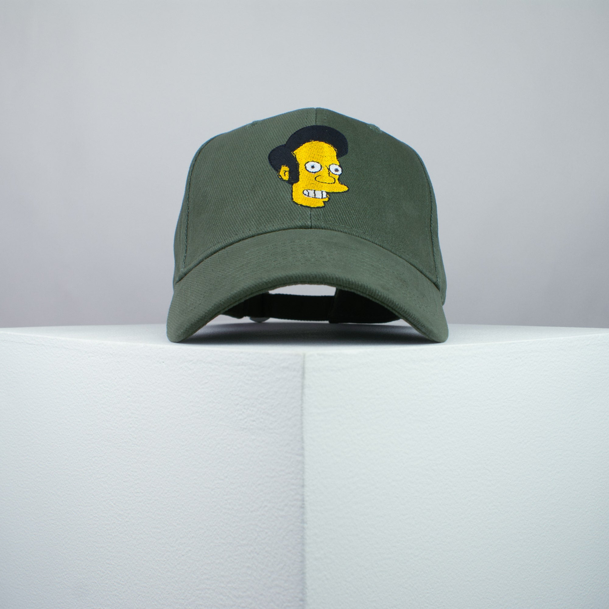Apu Nahasapeemapetilon embroidered baseball cap olive green / the simpsons / bart / marge / homer / embroidery / patch / hat / dad hat / cap / iron on patch / embroidered patch / badge / applique / embroidered / punk patches / trucker hat / snapback / caps / dad hats / baseball hat / mens hat / womens hat / embroidered hat / dad cap / embroidered cap
