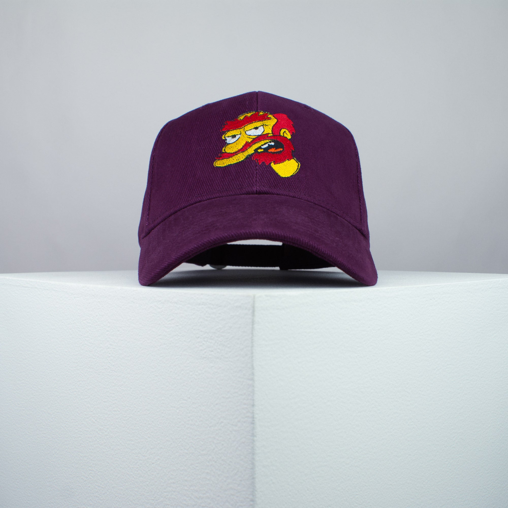 Groundskeeper Willie embroidered baseball cap burgundy / the simpsons / bart / marge / homer / embroidery / patch / hat / dad hat / cap / iron on patch / embroidered patch / badge / applique / embroidered / punk patches / trucker hat / snapback / caps / dad hats / baseball hat / mens hat / womens hat / embroidered hat / dad cap / embroidered cap